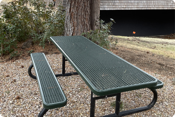 Picnic table outside the front of Mazama Gym