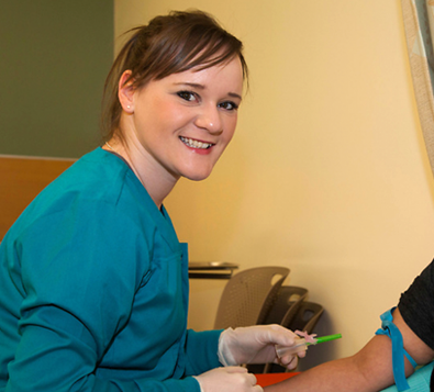 Medical Assistant preparing to insert an IV