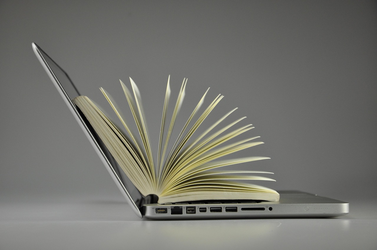 A pring book sitting on a laptop