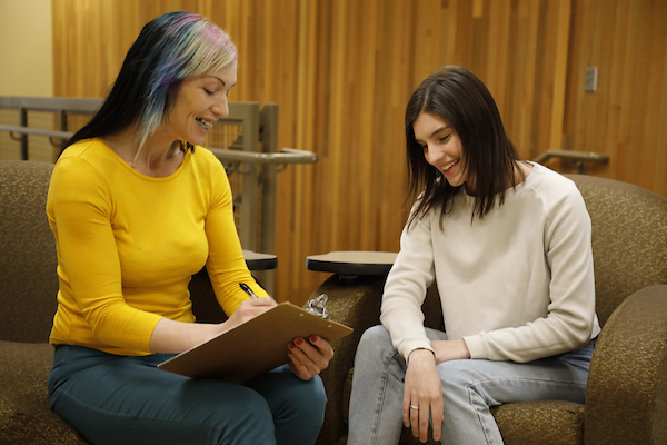 A student and teacher in a mock counseling session