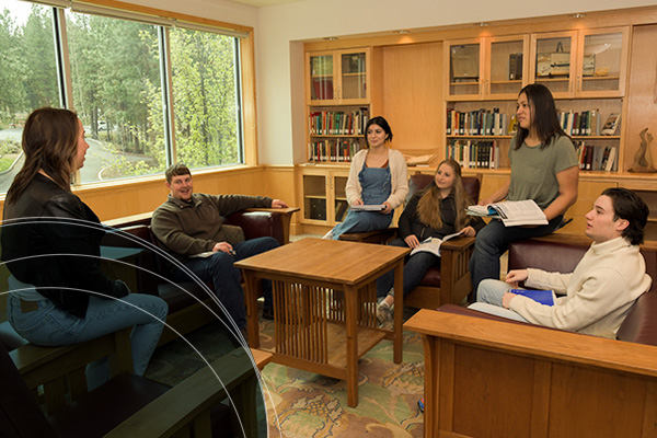 Community College Students Reviewing Financial Aid Options in Library