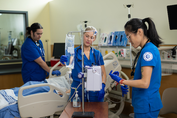 Nursing students working in a hands on environment