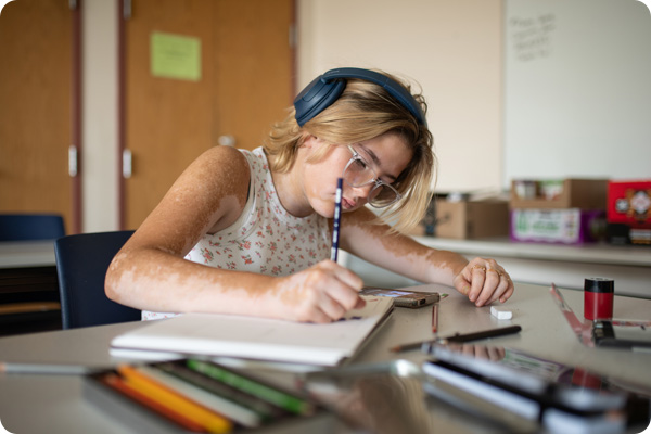 high school student taking notes
