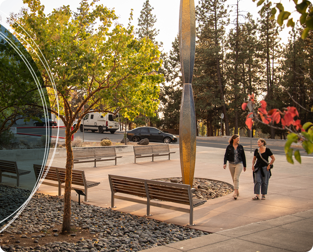 Two employees walk towards Health Careers having a conversation