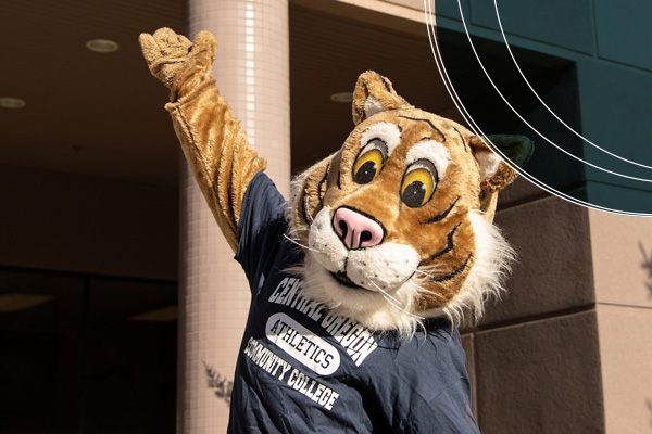 Bobcat Mascot waving in front of Boyle Education Center