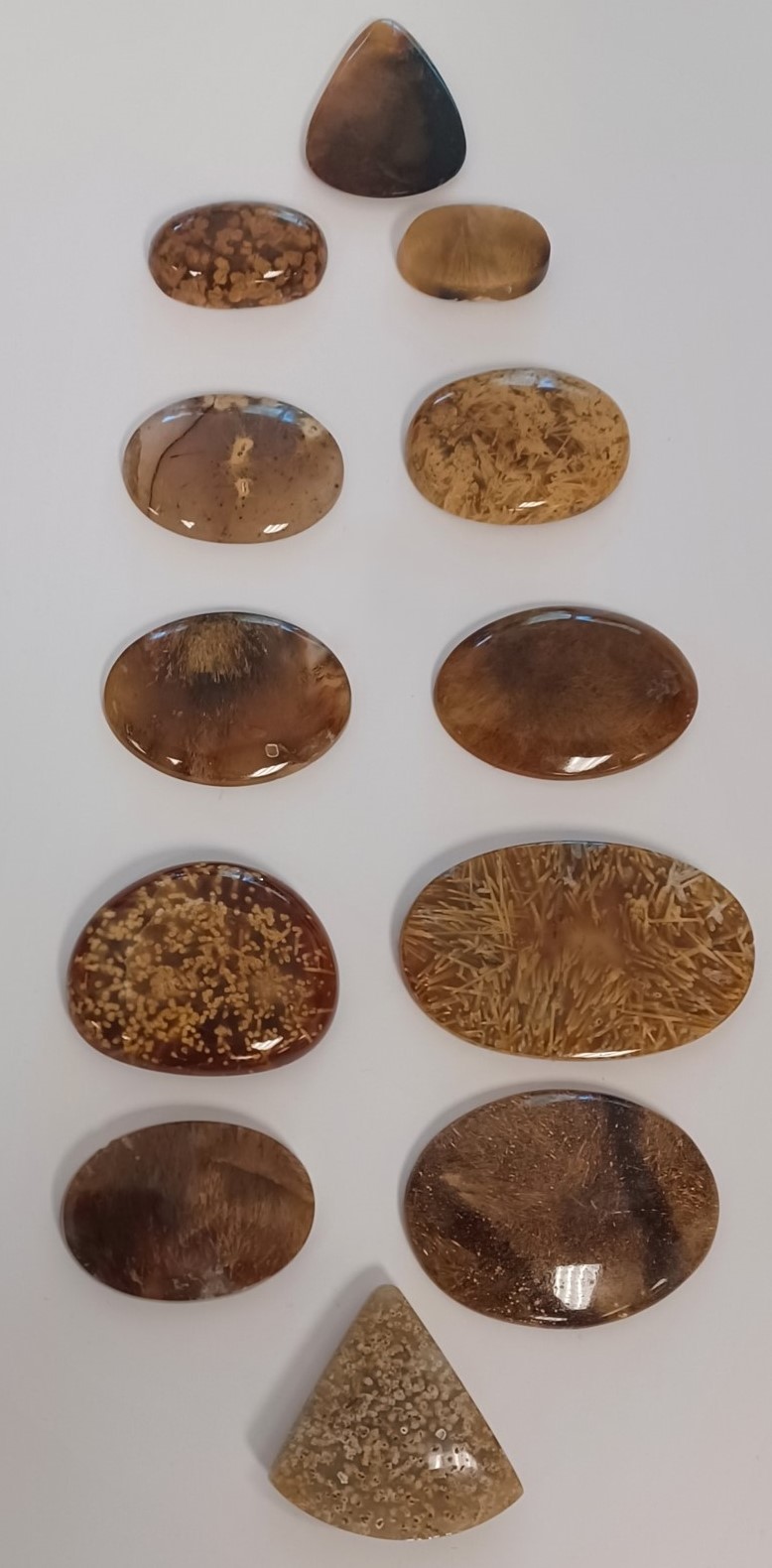 Larger pieces of agate with amber colored intrusions.