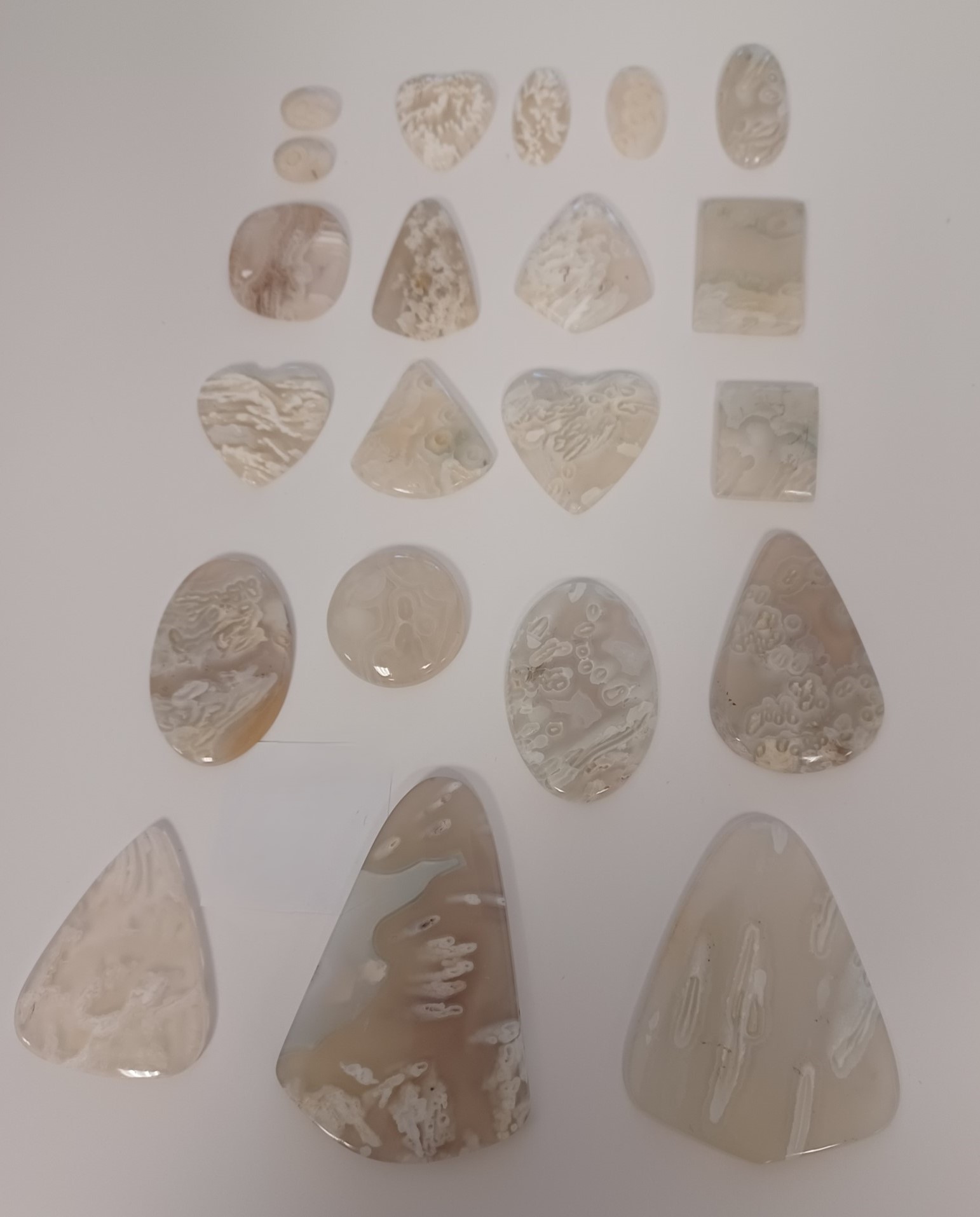 White agate in a variety of shapes and sizes.