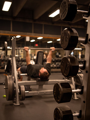 student lifting weights