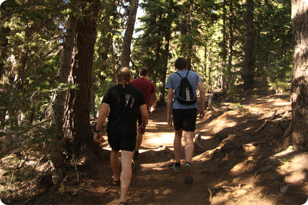 3 run club members hiking on a trail in Bend, Oregon