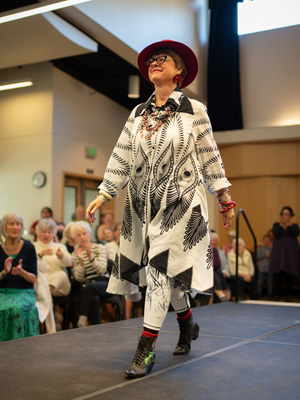 Retired Professor Lill-Ann Foreman strutting down the runway