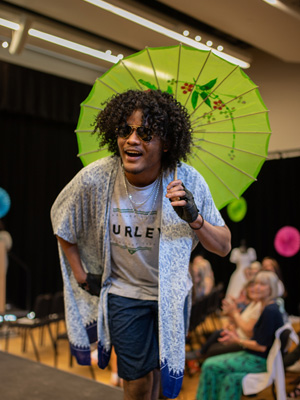 Student posing for the camera at the end of the runway