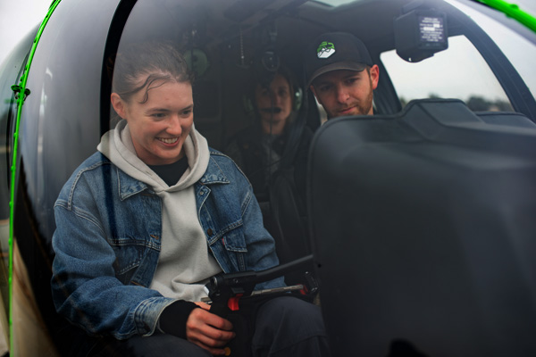 Students preparing for a flight lesson in a helicopter