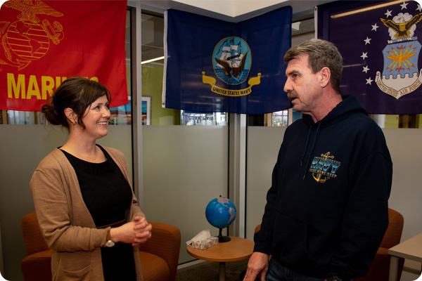 Bonnie Jordan chatting with a student in the Veterans Resource Center