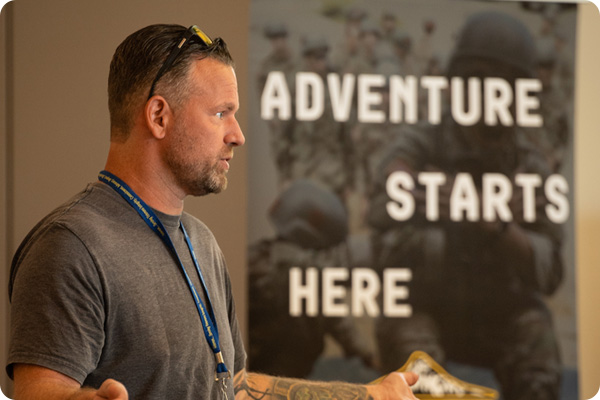 Army representative informing students about the Army Reserves at the Veterans Services Fair