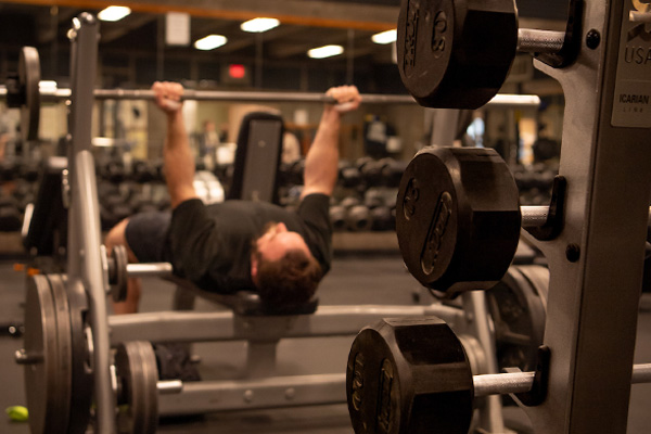 Woman running on treadmill in COCC physiology lab