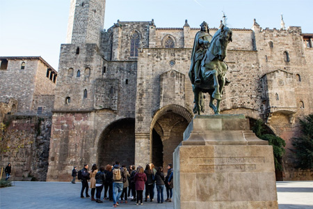 group of study abroad participants on a tour of a spanish castle